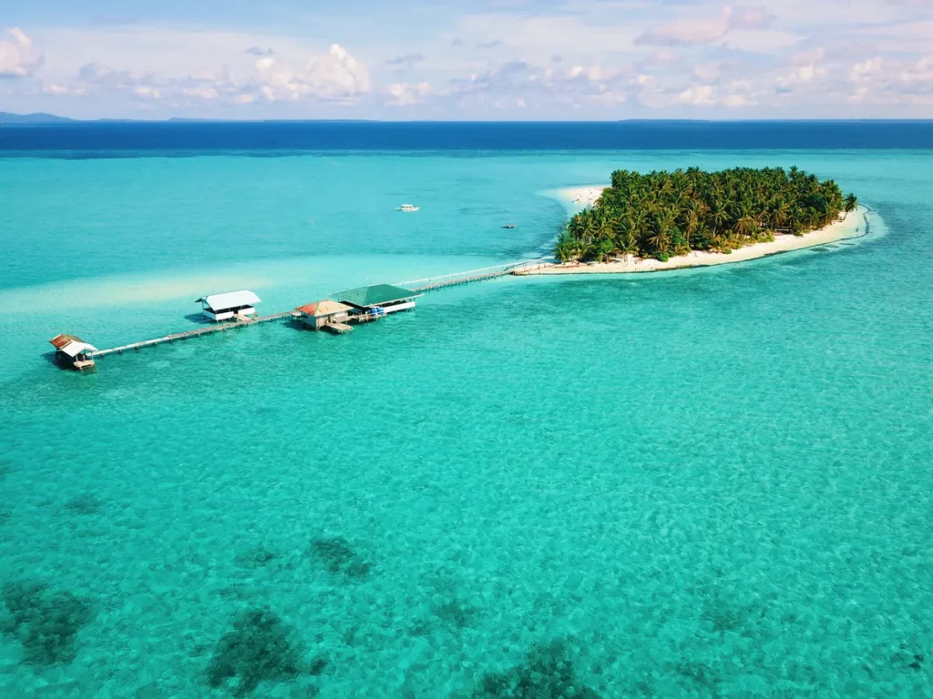 Aerial view of Onok Island, Balabac, with overwater cottages and turquoise water